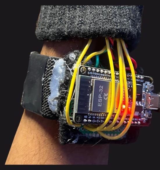 ESP32 controller mounted at the glove wrist